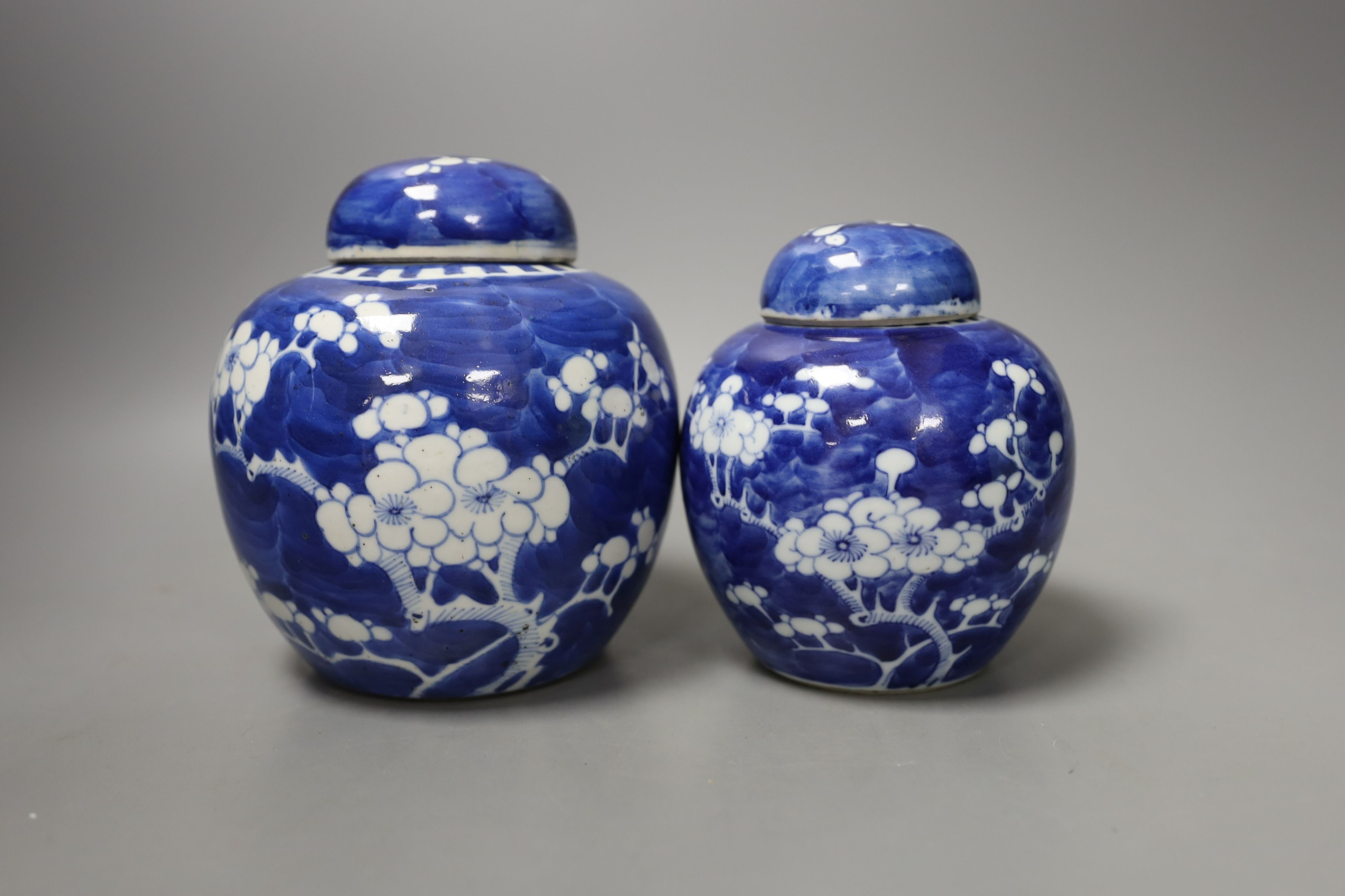 Three Chinese blue and white ginger jars and covers, a celadon plate and bamboo covered vase (5)